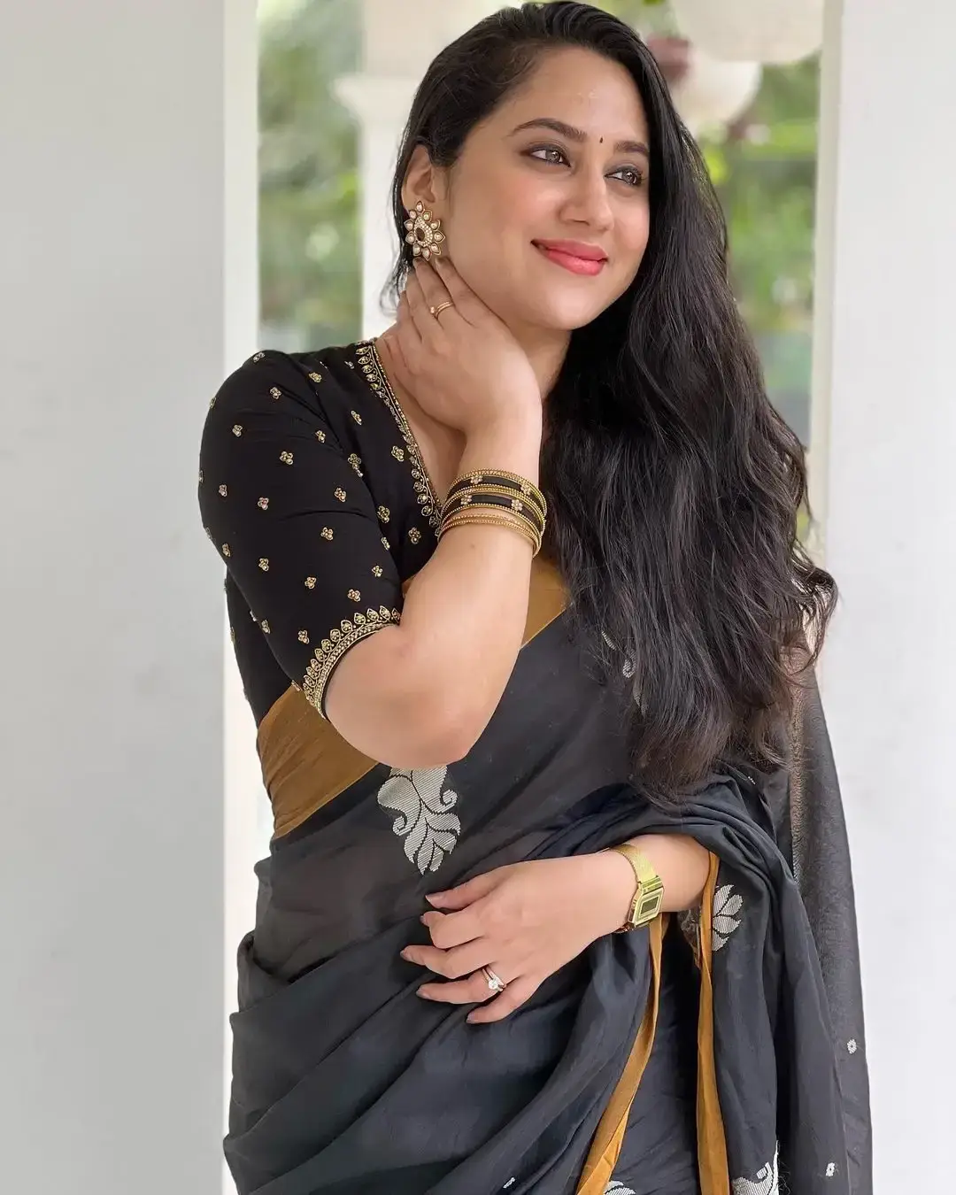 Beautiful Indian Queen Miya George in Traditional black Saree